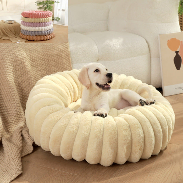 Round beige plush cat bed sleeping Angora cat